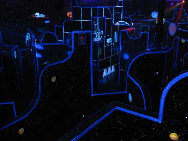 Blacklit space-themed laser tag arena at Glow Games Twin Falls